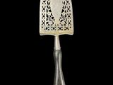 an antique silverware knife with a decorative design on the handle