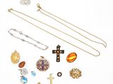 several different types of jewelry are arranged on a white surface