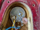a close up of a broken electrical outlet with wires