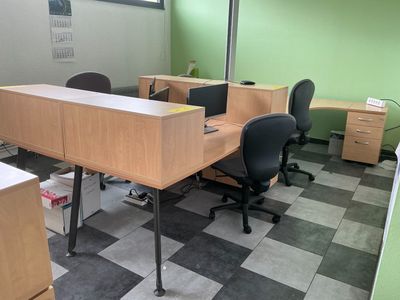 an image of an empty office with desks and chairs