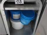 a trash can and buckets in the corner of a kitchen
