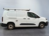 a white van that is parked in a room