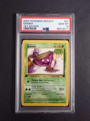 a close up of a pokemon card on a black surface