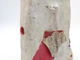 sculpture of a red and white object on a white surface
