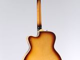 a close up of a guitar hanging from a string