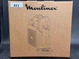 the box for the machine is open and ready to be used