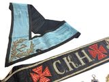 two sashes that are laying on a table