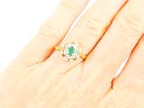 an image of a woman ' s hand with a ring on it