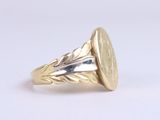 yellow gold ring with a coin in the middle of it