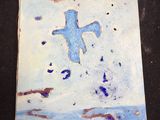 une peinture représentant une croix sur un carreau posé sur une table