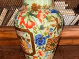 a vase that is sitting on a shelf in a room