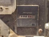 a close up of an old sewing machine with buttons on it