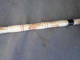 a baseball bat that has a design on it
