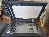 a printer that is sitting on top of a table
