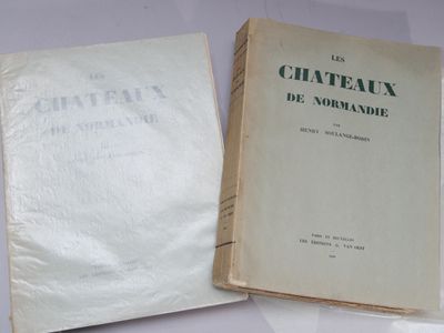two books sitting on top of a table next to each other