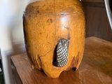an apple shaped box on a wooden table