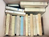 a box full of books that are sitting on the floor
