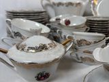 a lot of dishes and cups on the table