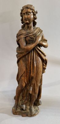 an image of a wooden statue of a woman holding a baby