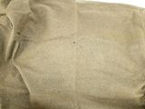 a piece of brown paper that has been torn off