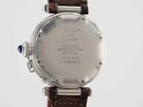 a close up of a watch with a brown leather strap