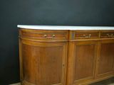 an image of a wooden sideboard with marble top on a wooden floor