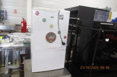 a refrigerator that is sitting in the middle of a room