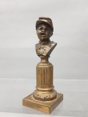 a bronze bust of a man with a hat on top of a pedestal