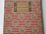 un livre rayé de rouge et de blanc posé sur une table