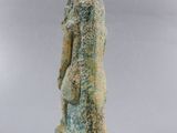an image of a statue of a woman standing on a wooden base