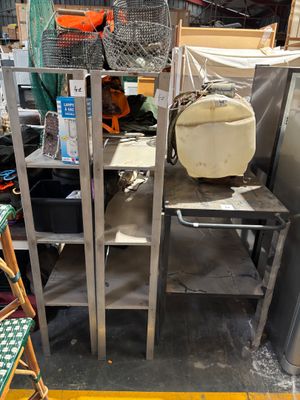 a metal shelf with a bag on top of it