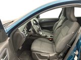 the interior of a car with the door open and the driver ' s seat down