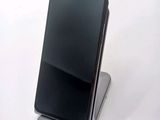 a phone that is sitting on top of a stand