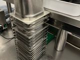 several pans stacked on top of each other in a kitchen