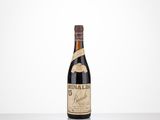 a bottle of wine sitting on top of a table