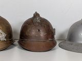 three different types of helmets sitting on a table