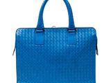 a blue handbag on a white background with a white background
