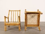 pair of bamboo and rattan lounge chairs with woven seats