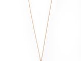 a black and gold necklace with a lock on a chain