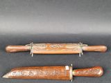 pair of carved wood and brass - plated knifes