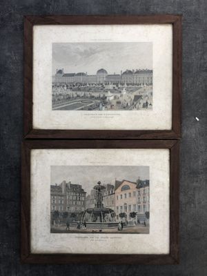 two framed pictures on the wall of a room