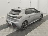 the rear end of a silver car parked in a garage
