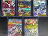 four different types of pokemon trading cards in plastic cases