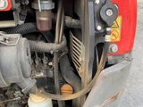 a close up of the engine of a red motorcycle