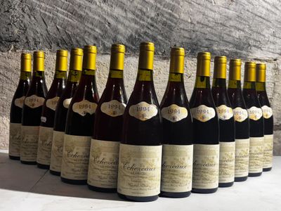 bottles of wine lined up in a row on a table