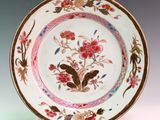 a white plate with a floral design on it