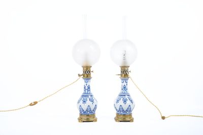 pair of blue and white porcelain lamps on gold chains