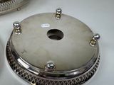 a silver plate with a hole in the middle of it