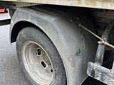 a close up of a flatbed truck with a chain on it