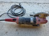 an image of a corded sander on the ground